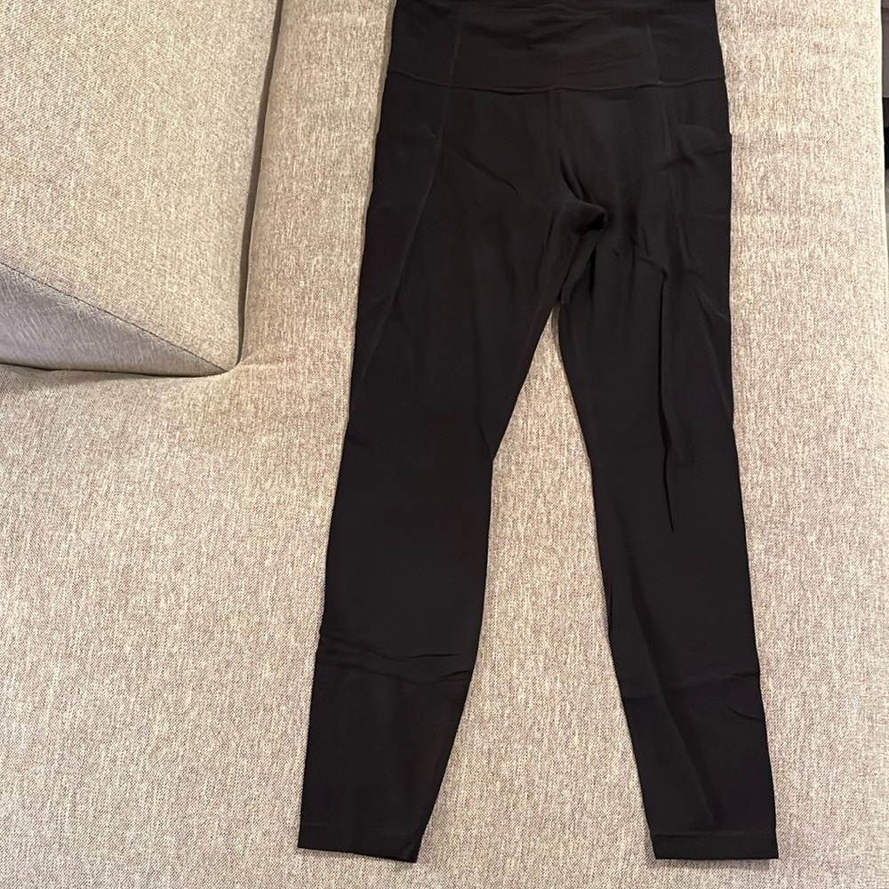 Athleta, black leggings, with pockets. 27 inch inseam.